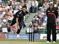 James Anderson in full flight watched by umpire Ian Ramage.jpg